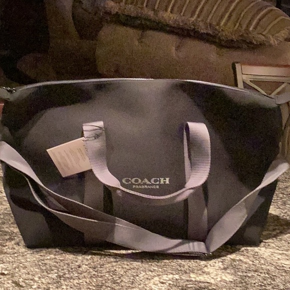 Coach MEN black duffle bag with silver lettering and gray straps NEW
